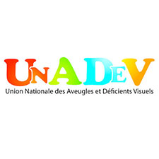 Logo Unadev – Le sigle UNADEV est formé de lettres capitales petites et grandes, rouges, vertes, bleues et orange. Dessous, en minuscules noires, on peut lire : Union Nationale des Aveugles et Déficients Visuels.